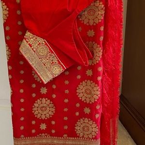 Indian outfit: Saree with matching blouse.